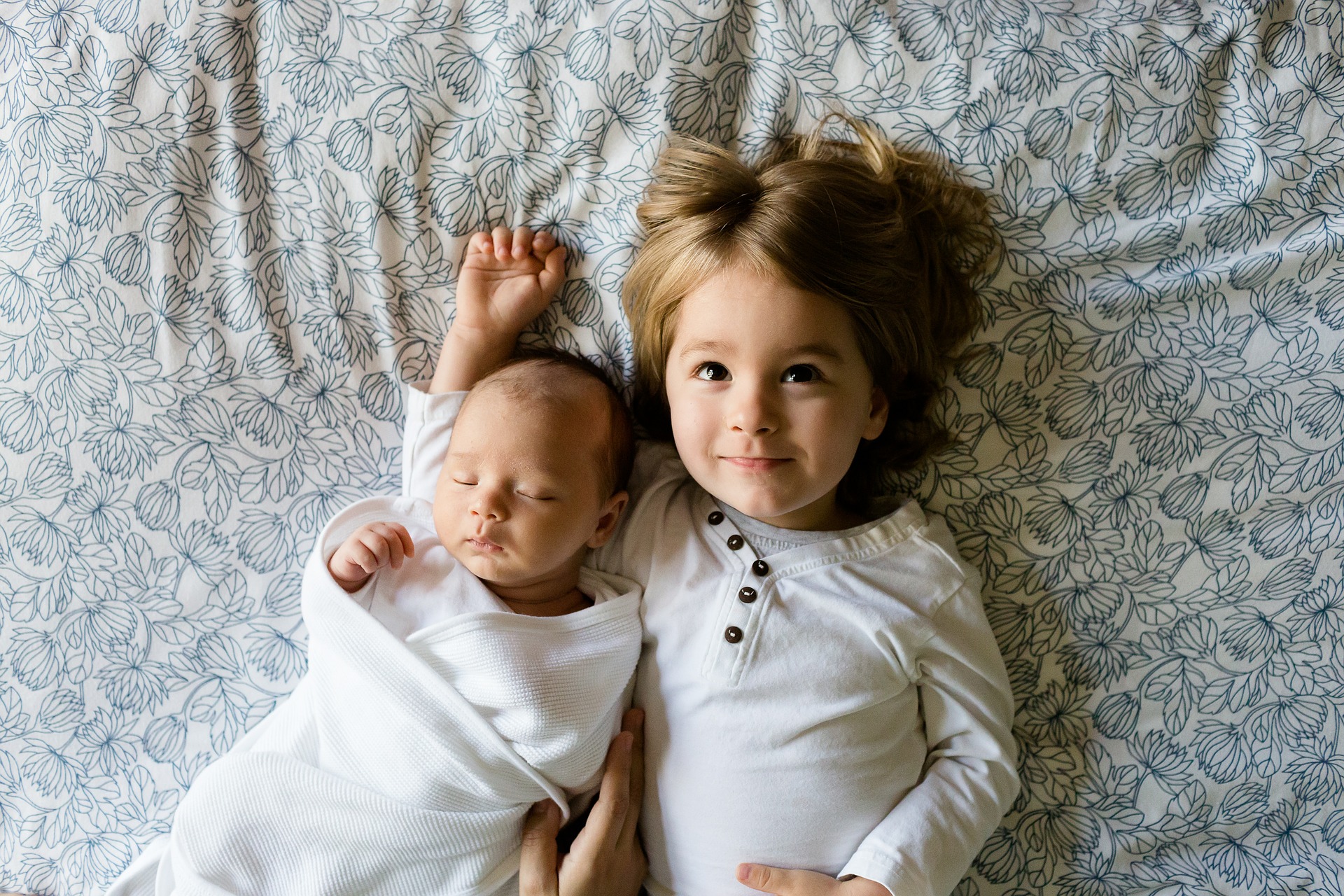 newborn baby and sister
