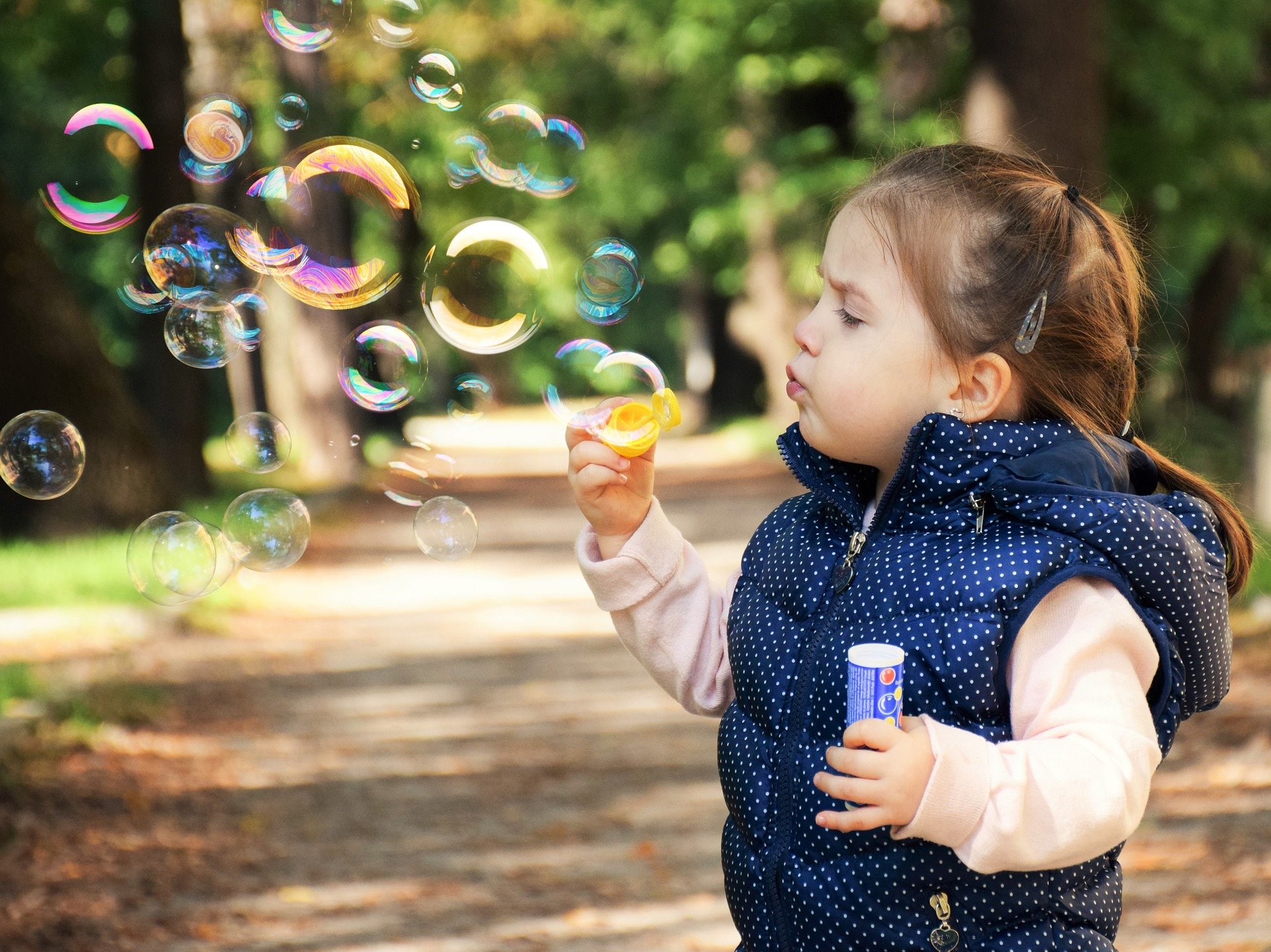 toddler girl with bubbles